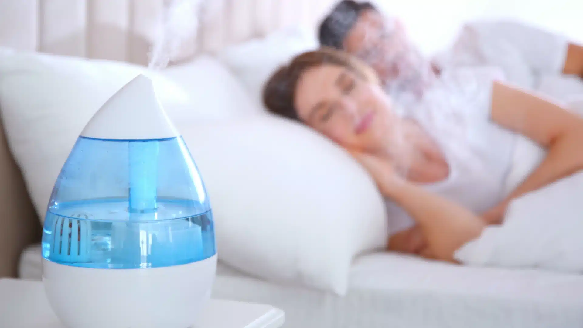 Health Hub 59 Couple sleeping with cool mist humidifier on nightstand