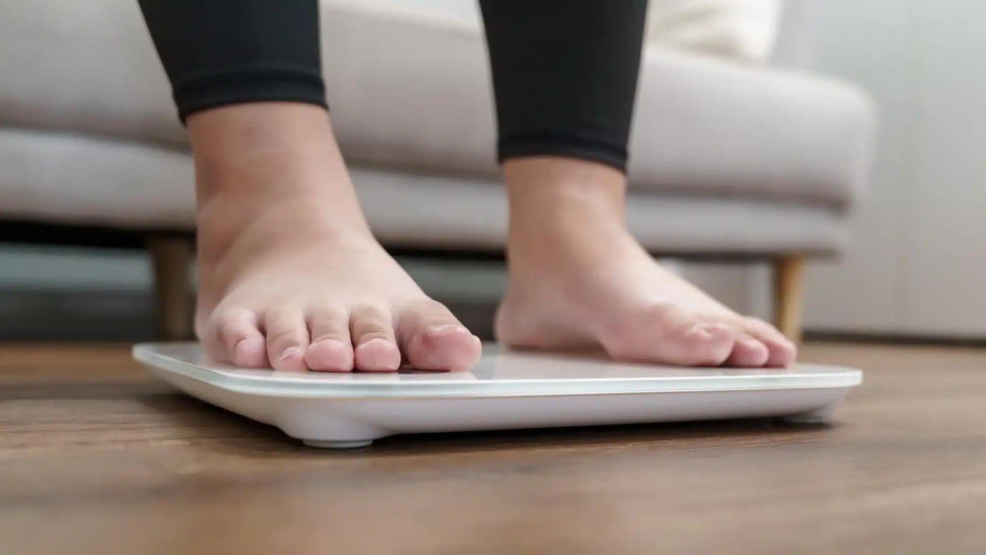 Health Hub 44 Person standing on digital weight scale at home for fitness and health tracking
